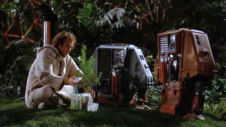 Freeman (Bruce Dern) sitting with his robot companions in "Silent Running."