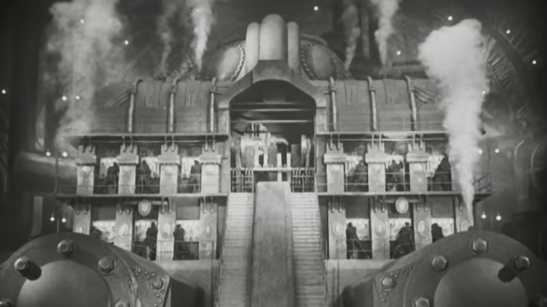 Metropolis scene of workers in underground power plant