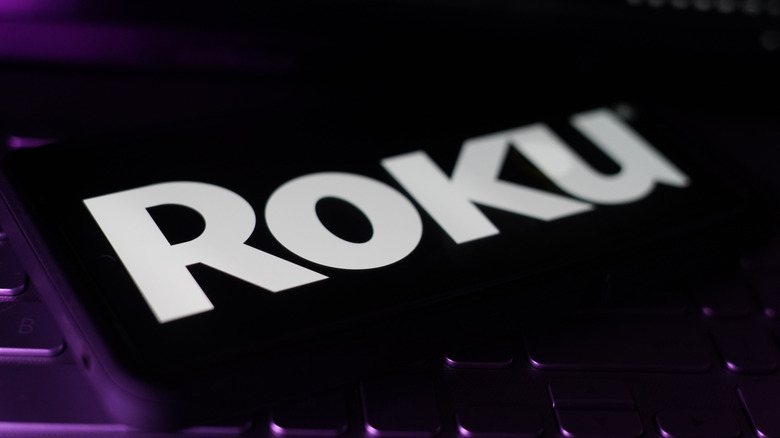 The Roku logo displayed on a smartphone screen
