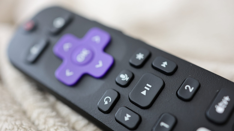 A close-up blurred image of a Roku voice remote.