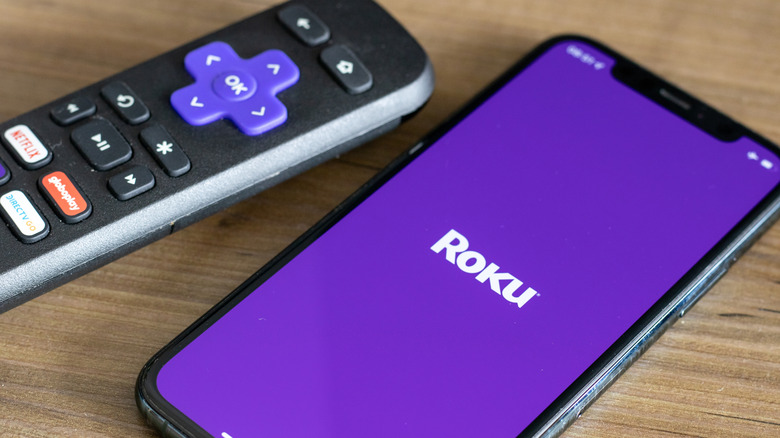 Roku app on a phone next to a controller
