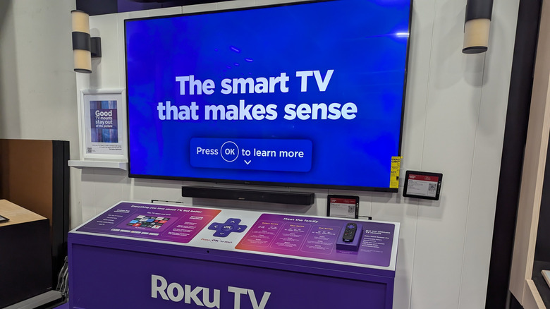 A Roku smart TV on a sales display with a Roku remote