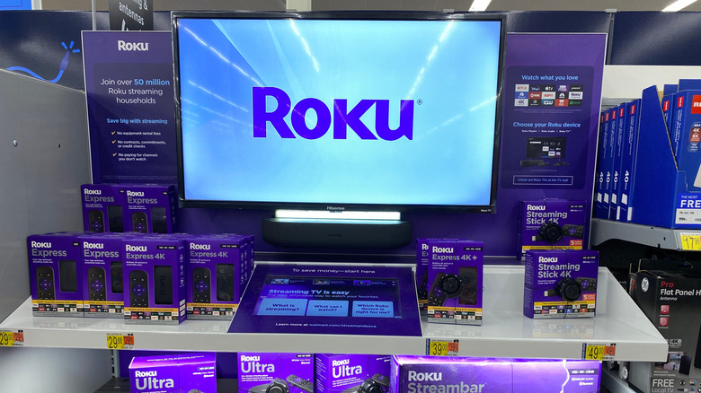 Roku TV and streaming boxes on display in an electrronics store
