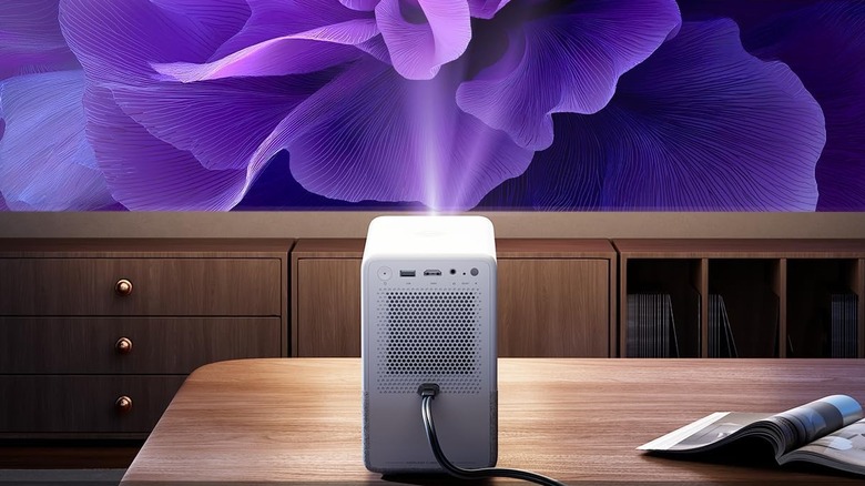 The Aurzen Roku TV Smart Projector D1R Cube projecting a picture.