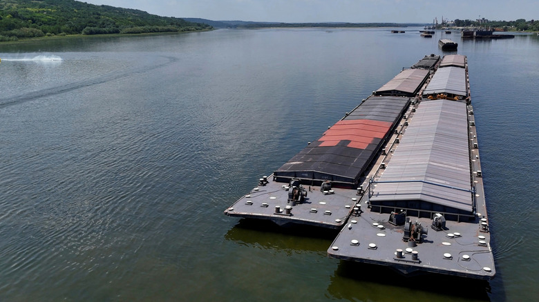 Romania - July 22, 2026: Stationary barges rest on the Danube River near Oltenita, Romania