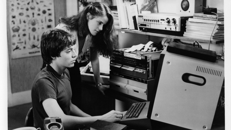 A black-and-white still of Matthew Broderick and Ally Sheedy's characters in WarGames.