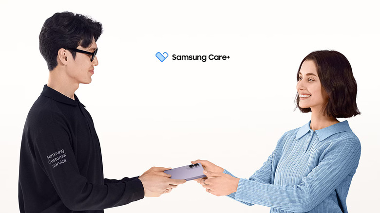 A smiling woman hands her phone to a Samsung customer service employee, the Samsung Care+ logo is between them