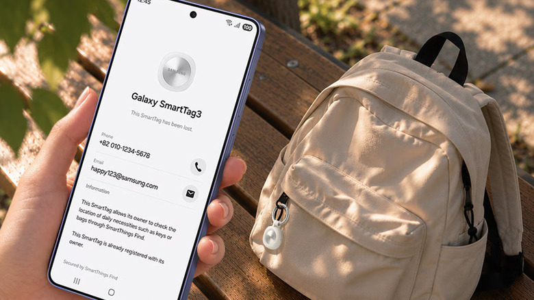 Phone with Galaxy SmartTag 3 pulled up on display, backpack with tag attached in background