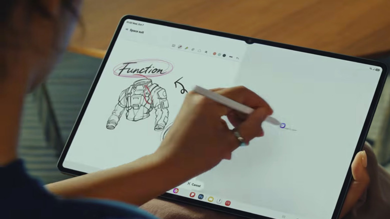 A woman drawing on the Samsung Galaxy Tab S12 Ultra
