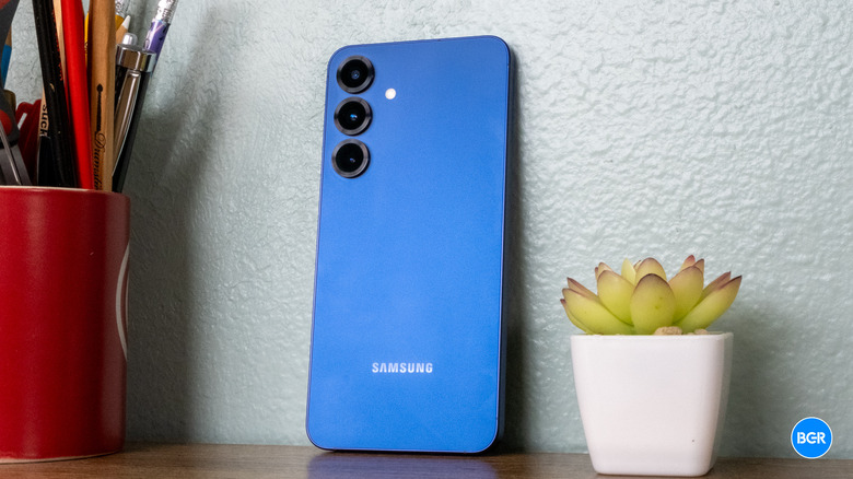 Back of Samsung Galaxy S25 as it rests against a wall