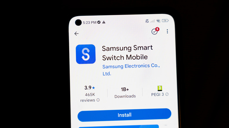 smartphone showing samsung smart switch mobile app on black background