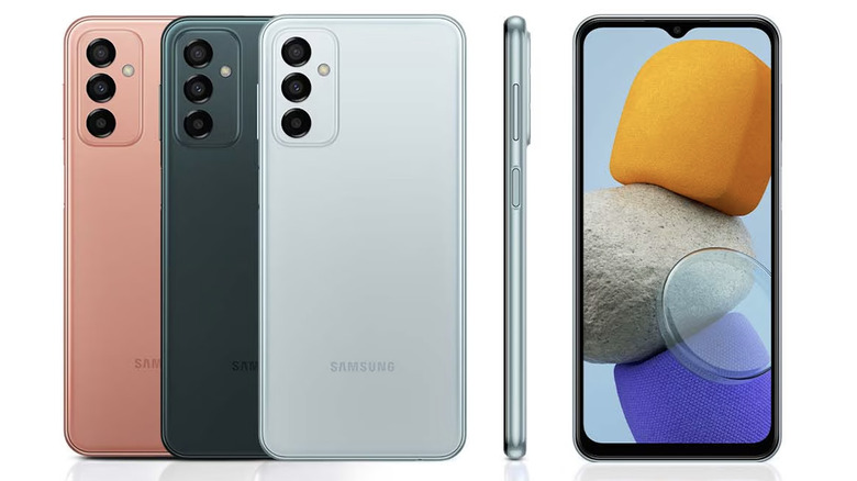 Samsung Galaxy M13 in peach, dark green, and light mint colors, shown from the rear, alongside a side profile and a front display view.