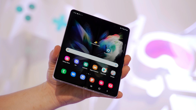 Galaxy Z Fold smartphone opened in someone's hand