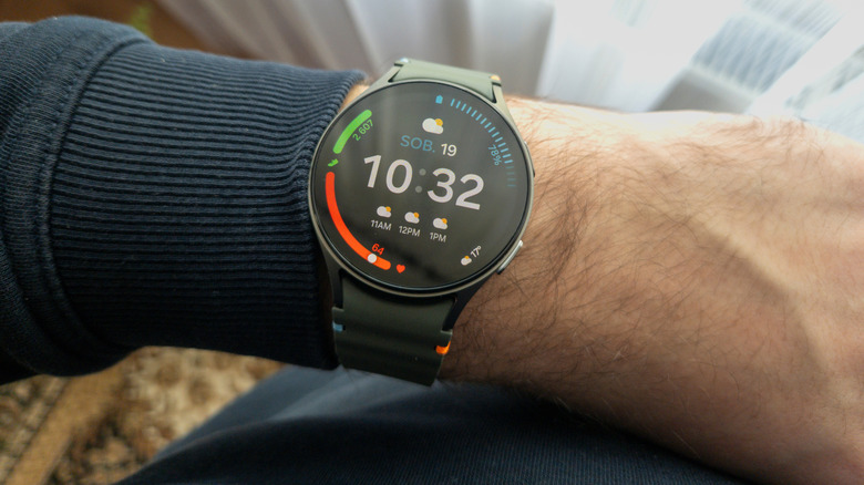 A modern Galaxy Watch on a wrist.