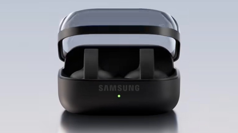 Black Samsung Galaxy Buds On sitting inside their black charging case, the case sits against a soft blue background