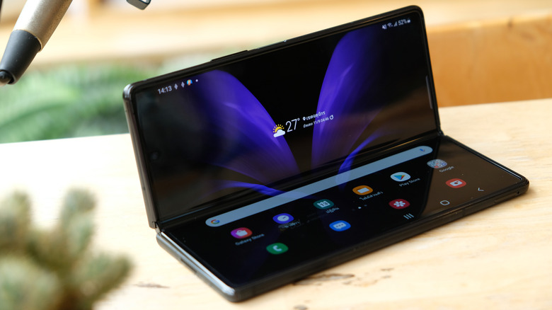 galaxy z fold smartphone sitting on a table, folded up