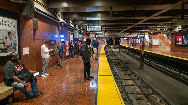People waiting for a San Francisco Muni Metro subway train at a station