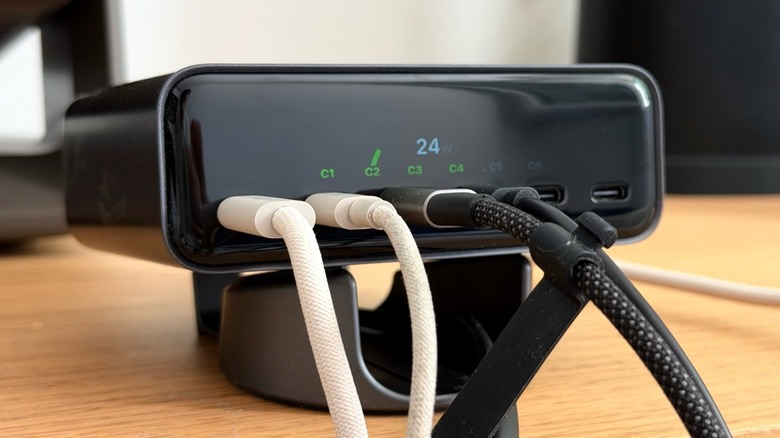 Close-up shot of Satechi's ChargeView accessory with four USB-C cables attached to it and the wattage display shown.