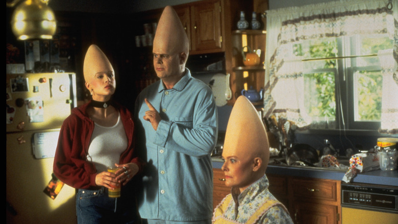 Screenshot from Coneheads film featuring the family in the kitchen