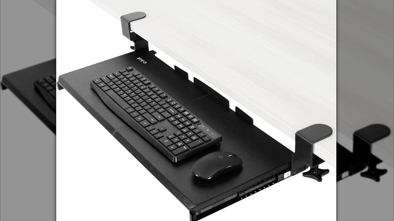 A Vivo Under Desk Keyboard Tray under a desk.