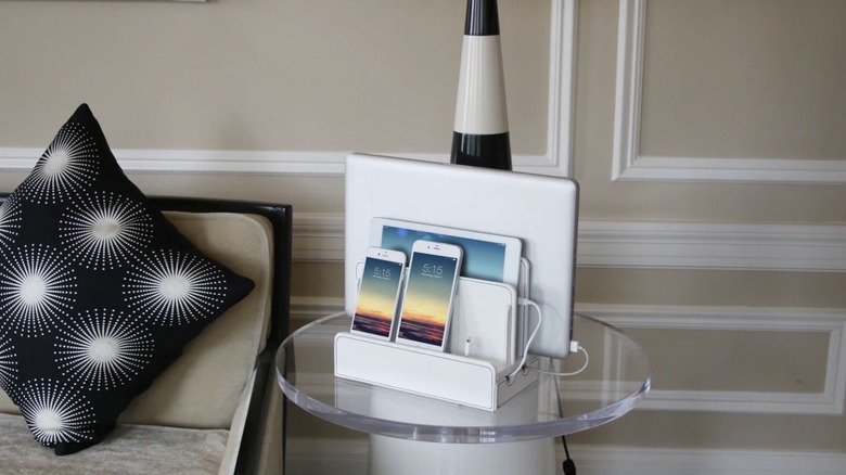 A GUS all in one charging station on a side table