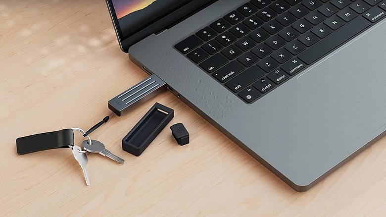 Seagate compact SSD plugged into computer on keychain.