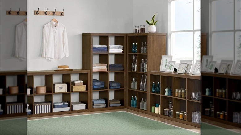 The Bayside Furnishings Onin Room Divider with 8 Organizers being used as an entertainment center.