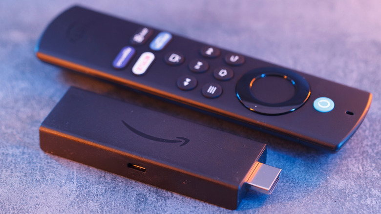 Close up of an Amazon Fire Stick TV device and remote