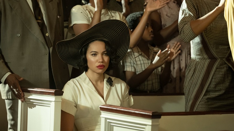 Jurnee Smollett within Season 1, Episode 3 of the series "Lovecraft Country," she is seated on a church pew