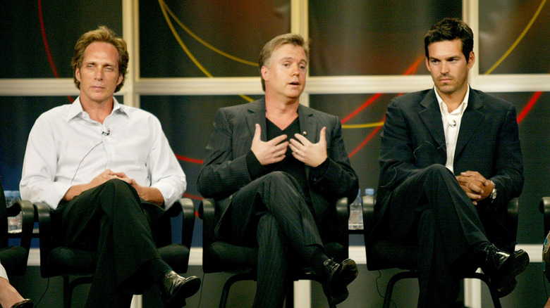 Actor William Fichtner, series creator Shaun Cassidy, and actor Eddie Cibrian sitting next to each other as they discuss the series "Invasion" on a stage