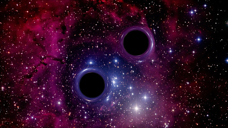Diagram and image showing two black holes orbiting each other