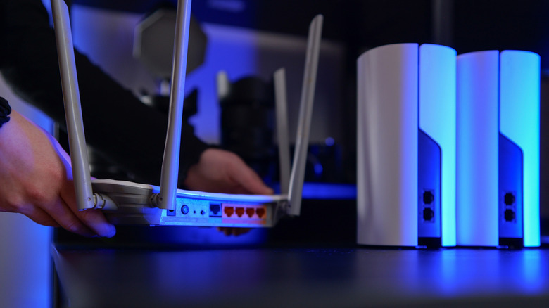 A Wi-Fi router and extenders sitting on a table