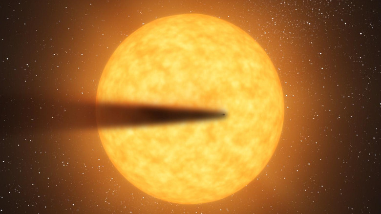 Illustration of comet-like tail of a possible disintegrating planet KIC 12557548
