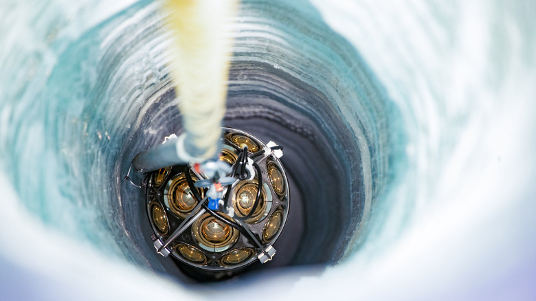 Scientists send light sensors into ice underneath the South Pole