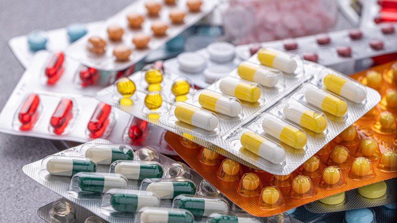 Various packaged pills of different shapes and colors