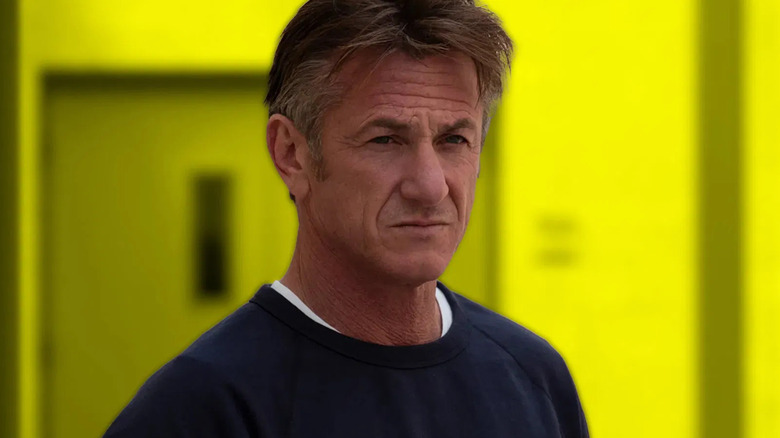 Sean Penn standing in a yellow room on 