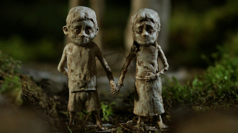 Carved wooden children figurines.