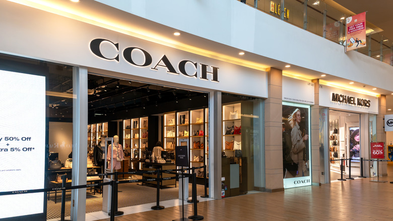 a Coach store and Michael Kors store in a mall
