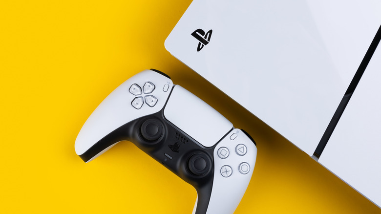 PlayStation 5 controller and the console on a yellow background