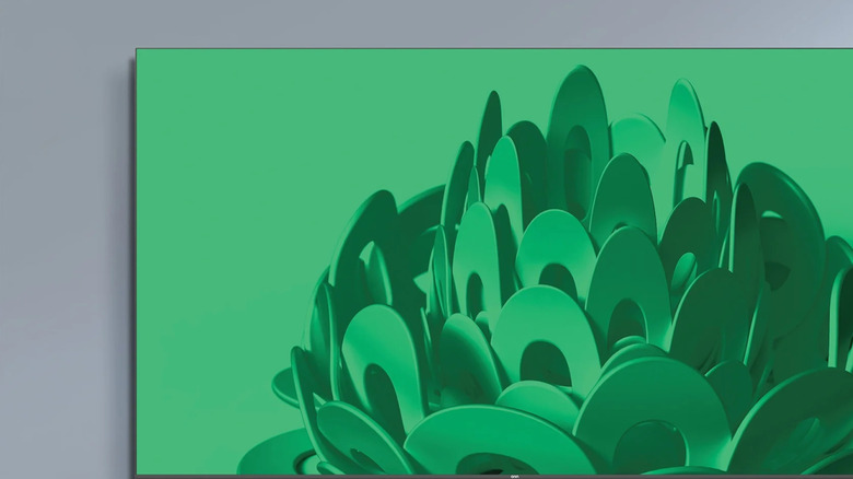 An Onn TV mounted to a wall above a TV stand.