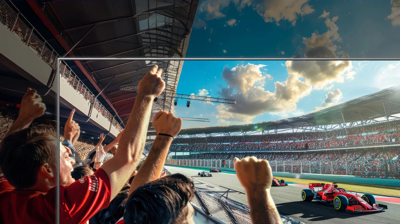 A racing event as seen through the outline of an Onn TV.