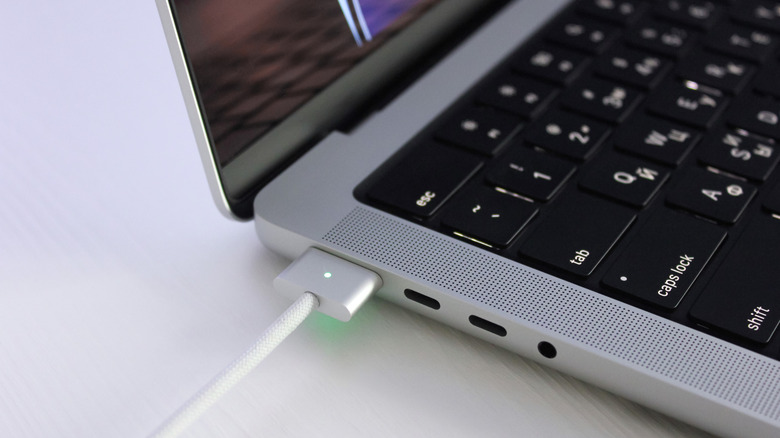 Charging a MacBook Pro via MagSafe.