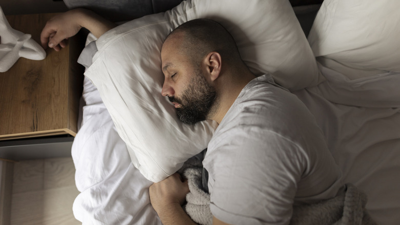 a man sleeping in bed