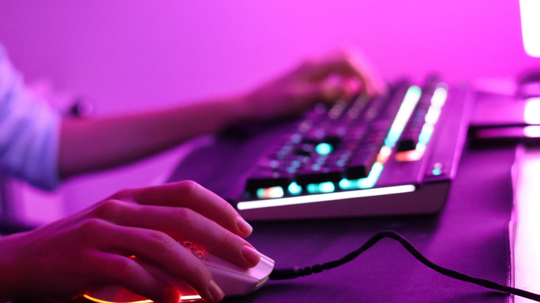 Person using a gaming keyboard.