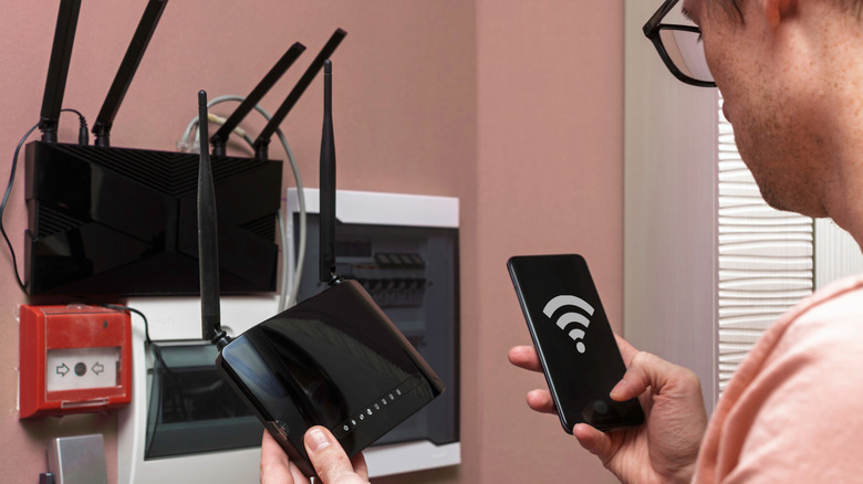 Man configuring a Wi-Fi router