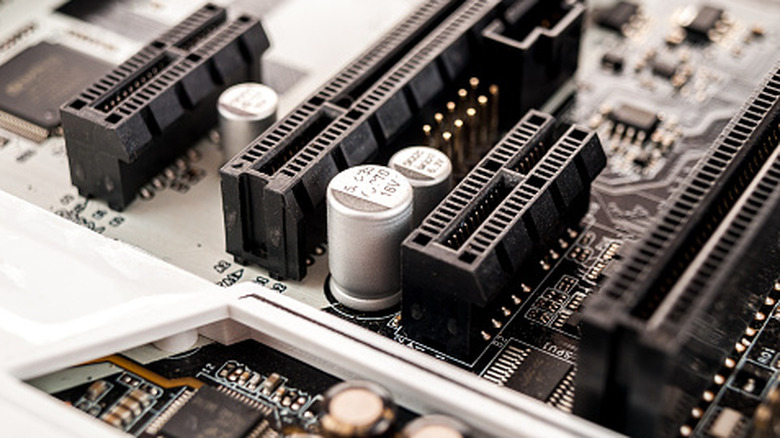 A close-up of a motherboard showing multiple expansion slots.