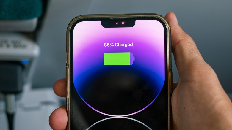 An iPhone displaying its battery charging percentage, which is at 85 percent