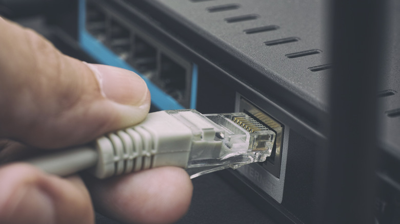 plugging ethernet cable into a router