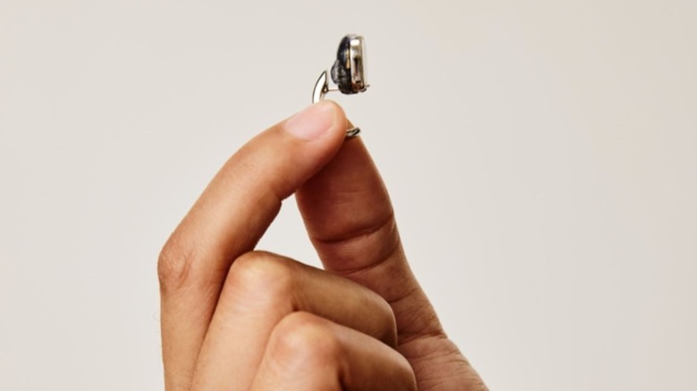 Lumia 2 smart earring held in a hand to show a close up of the device.