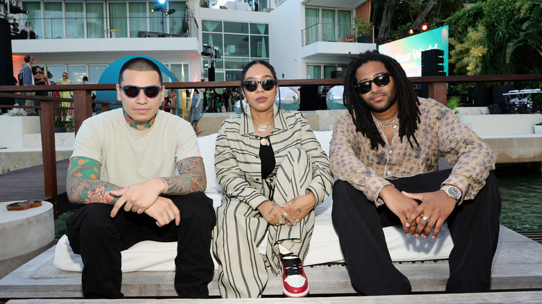 Models wearing Meta smart glasses at a social event.